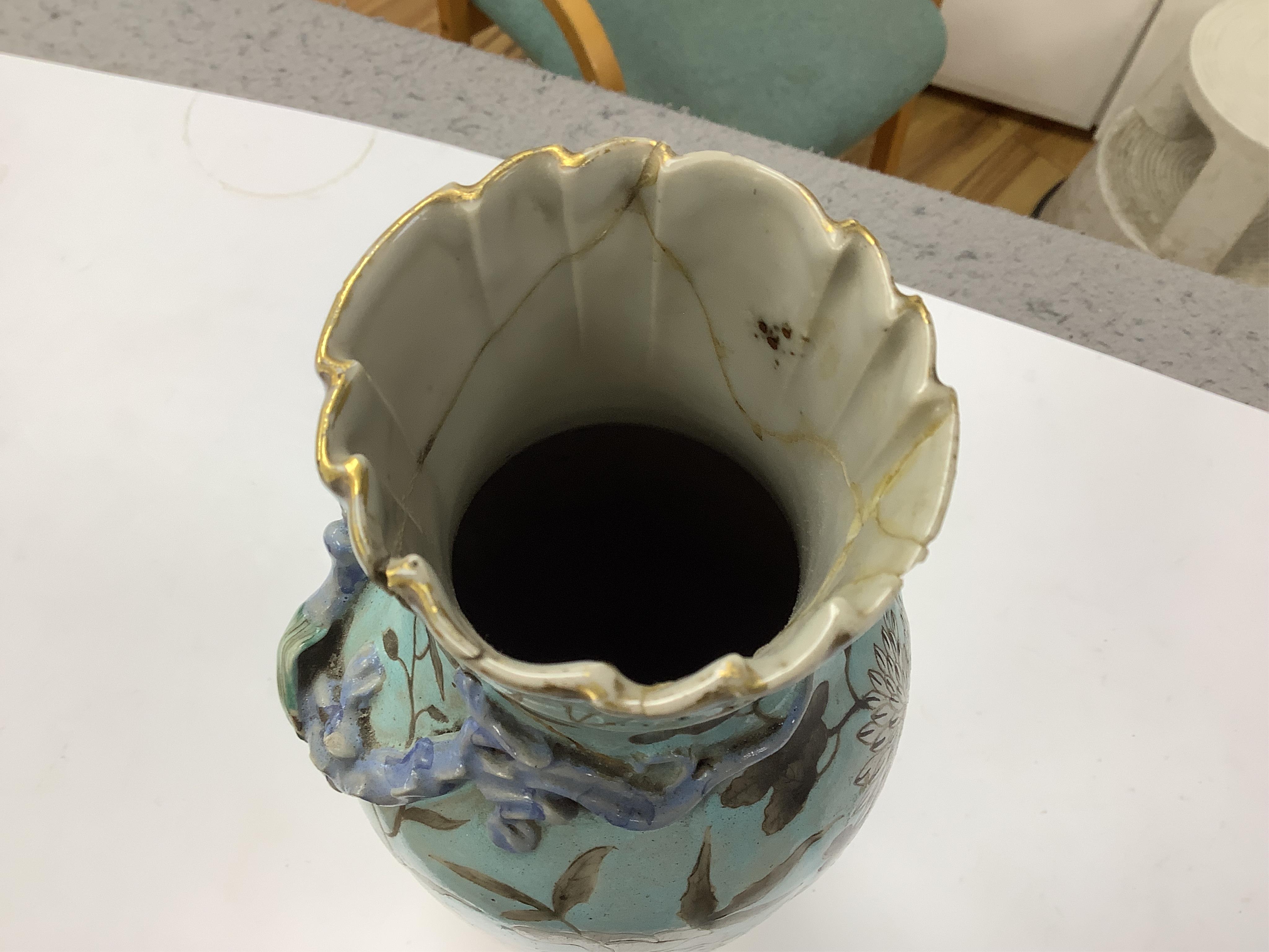 A pair of late 19th century Chinese blue glazed ‘dragon’ vases, 26cm high